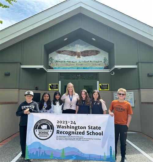 FHES Students and Principal with sign